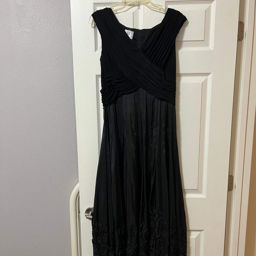 Black formal dress with a-line top and bottom detail